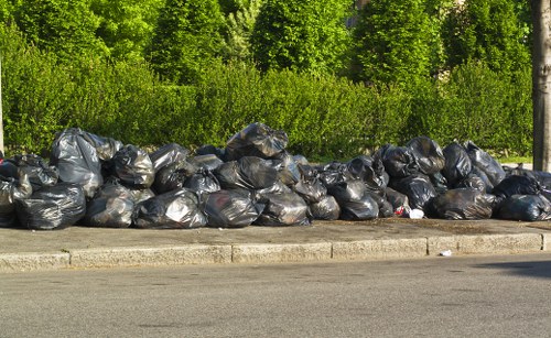 Workers handling construction waste for proper disposal
